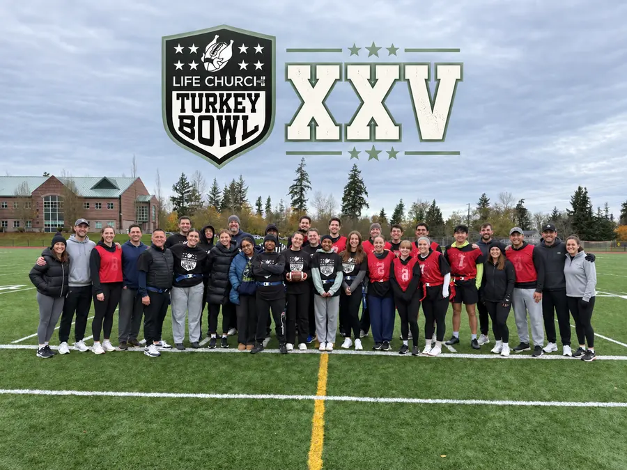 Turkey Bowl group photo with the Life Church Turkey Bowl badge and XXV, marking the 25th annual event